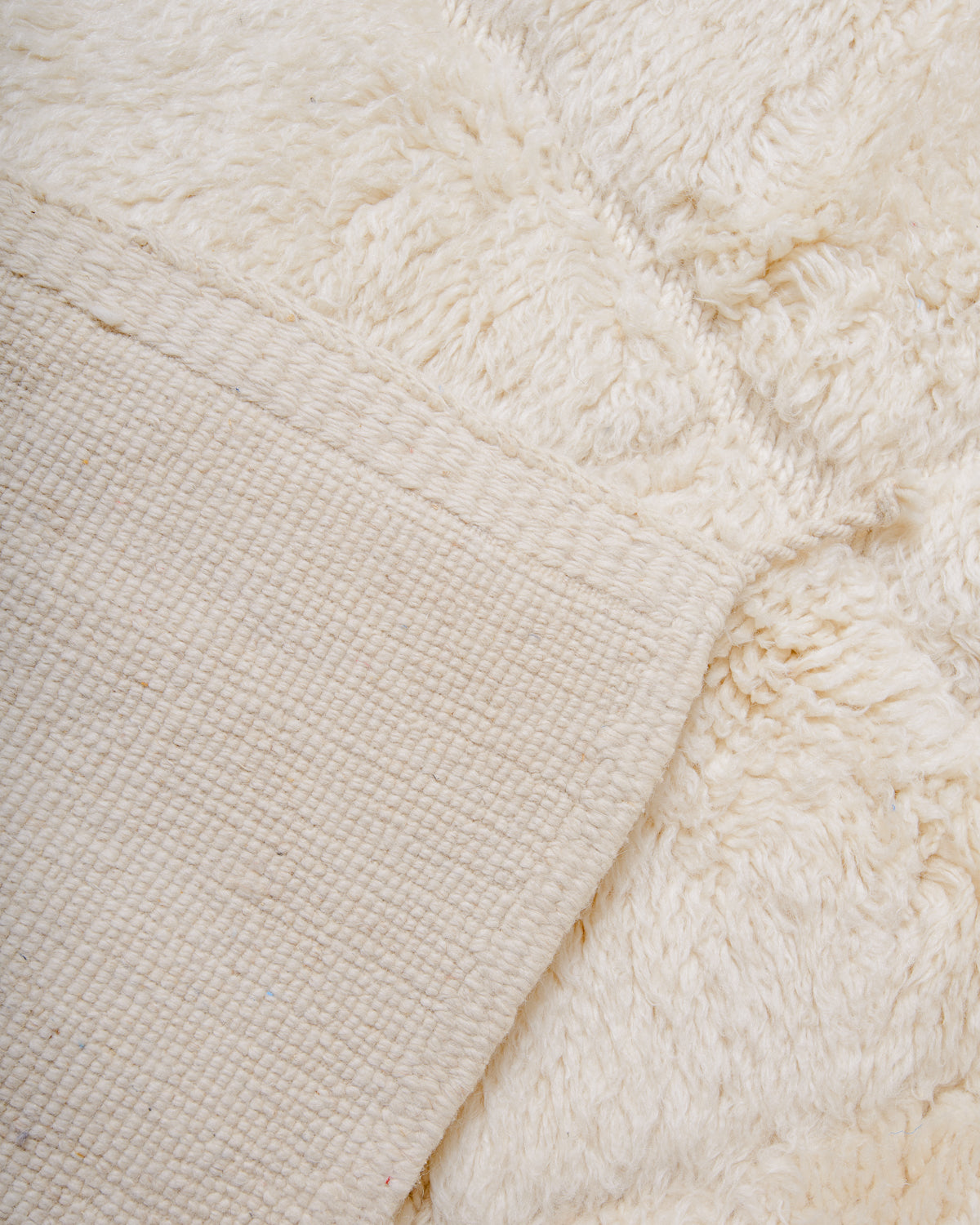 Modern, designer, handcrafted 100% sheep’s wool Berber rug from Morocco. Beni M’rirt carpet with beautiful colours and patterns and fluffy wool texture.